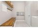 Bright laundry room with washer, dryer, and built-in cabinets at 15107 Lake Claire Overlook Dr, Winter Garden, FL 34787