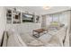 Cozy living room with built-in shelving and a large sectional sofa at 15107 Lake Claire Overlook Dr, Winter Garden, FL 34787