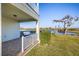 Relaxing patio with fire pit overlooking a peaceful lake at 15107 Lake Claire Overlook Dr, Winter Garden, FL 34787