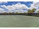 Two well-maintained tennis courts at 15107 Lake Claire Overlook Dr, Winter Garden, FL 34787