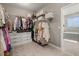 Spacious walk-in closet with custom shelving and ample hanging space at 15107 Lake Claire Overlook Dr, Winter Garden, FL 34787