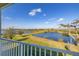 Stunning view of a tranquil lake from a private balcony at 15107 Lake Claire Overlook Dr, Winter Garden, FL 34787