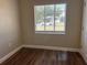 Cozy bedroom with new floors, neutral paint, and lots of natural light at 1601 Pontiac Ct, Orlando, FL 32808