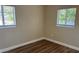 This bedroom offers laminate flooring, natural light, and updated paint at 1601 Pontiac Ct, Orlando, FL 32808