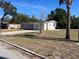 This single-story house boasts a spacious front yard and driveway and has a neutral, modern paint scheme at 1601 Pontiac Ct, Orlando, FL 32808