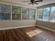 Bright sunroom with large windows offering abundant natural light and serene views at 1601 Pontiac Ct, Orlando, FL 32808