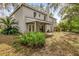 House's backyard features a large green space and covered patio at 1700 Bridlewalk Ct, Gotha, FL 34734