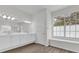 Main bathroom with double vanity, large window, and linen closet at 1700 Bridlewalk Ct, Gotha, FL 34734