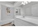 Bathroom with double vanity, a window, and white tile at 1700 Bridlewalk Ct, Gotha, FL 34734
