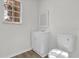 Clean bathroom with white vanity, toilet and a window at 1700 Bridlewalk Ct, Gotha, FL 34734