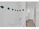 Bathroom with shower/tub combo and green tile accents at 1700 Bridlewalk Ct, Gotha, FL 34734