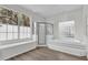 Bathroom with soaking tub, shower, and a window at 1700 Bridlewalk Ct, Gotha, FL 34734