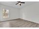 Bedroom with ceiling fan, window and wood-look floors at 1700 Bridlewalk Ct, Gotha, FL 34734