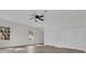 Bedroom with wood-look floors, double door closets, and windows at 1700 Bridlewalk Ct, Gotha, FL 34734