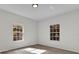 Spacious bedroom with two windows and wood-look floors at 1700 Bridlewalk Ct, Gotha, FL 34734