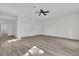 Bedroom with wood-look floors, double door closets, and ceiling fan at 1700 Bridlewalk Ct, Gotha, FL 34734