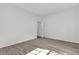 Bright bedroom with wood-look floors and an open door at 1700 Bridlewalk Ct, Gotha, FL 34734