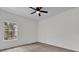 Bright bedroom with large window and ceiling fan at 1700 Bridlewalk Ct, Gotha, FL 34734