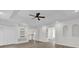 Spacious bedroom with wood-look floors, built-in shelving, and ceiling fan at 1700 Bridlewalk Ct, Gotha, FL 34734