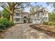 Large two-story house with mature landscaping and a long driveway at 1700 Bridlewalk Ct, Gotha, FL 34734