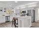 Modern kitchen with white cabinets and a large island at 1700 Bridlewalk Ct, Gotha, FL 34734