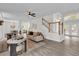 Open living room with a view of the kitchen and dining area at 1700 Bridlewalk Ct, Gotha, FL 34734