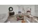 Living room with hardwood floors, comfortable seating and a view into the dining area at 1700 Bridlewalk Ct, Gotha, FL 34734