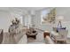 Spacious living room featuring comfortable seating, a coffee table, and large windows at 1700 Bridlewalk Ct, Gotha, FL 34734