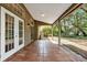 Spacious patio with terracotta tile flooring and access to backyard at 1700 Bridlewalk Ct, Gotha, FL 34734