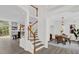 Modern staircase with white railings and wooden steps at 1700 Bridlewalk Ct, Gotha, FL 34734
