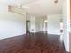 Spacious living room featuring hardwood-style floors and a high ceiling at 1717 Minnow Ct, Poinciana, FL 34759