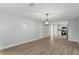 Open concept dining room featuring laminate floors and a modern light fixture at 2076 Leanne Ct, Winter Park, FL 32792