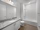 Bathroom with a bathtub, toilet and granite vanity at 2514 Park Ridge St, Apopka, FL 32712