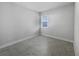 Simple bedroom with tile flooring and a window with blinds at 2514 Park Ridge St, Apopka, FL 32712