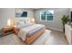 Bright bedroom with a light wooden bed frame and neutral color scheme at 2514 Park Ridge St, Apopka, FL 32712