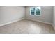 Empty bedroom with neutral-colored tile floors at 2514 Park Ridge St, Apopka, FL 32712