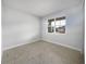 Bright bedroom with tile floors and a large window at 2514 Park Ridge St, Apopka, FL 32712