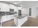 Modern kitchen featuring white cabinets, granite counters, and an island at 2514 Park Ridge St, Apopka, FL 32712