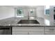 Kitchen island with granite countertop and stainless steel sink at 2514 Park Ridge St, Apopka, FL 32712