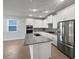 Modern kitchen with stainless steel appliances and granite island at 2514 Park Ridge St, Apopka, FL 32712