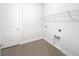 Clean laundry room with tile floors and wire shelving at 2514 Park Ridge St, Apopka, FL 32712