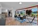 Relaxing covered patio with seating area and backyard views at 2808 Touraine Ave, Orlando, FL 32812