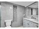 Modern bathroom with gray tile and a floating vanity at 2808 Touraine Ave, Orlando, FL 32812