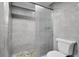 Clean bathroom with gray tile shower and updated toilet at 2808 Touraine Ave, Orlando, FL 32812