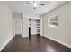Bedroom with dark hardwood floors and built-in shelving at 2808 Touraine Ave, Orlando, FL 32812