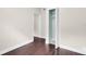 Bright bedroom with dark hardwood floors and a spacious closet at 2808 Touraine Ave, Orlando, FL 32812