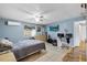 Main bedroom with a dresser, desk, and large TV at 2808 Touraine Ave, Orlando, FL 32812