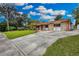 Stone home with large driveway and expansive lawn at 2808 Touraine Ave, Orlando, FL 32812
