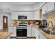 Bright kitchen features granite countertops and stainless steel appliances at 2808 Touraine Ave, Orlando, FL 32812
