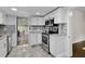 Modern kitchen with stainless steel appliances and granite countertops at 2808 Touraine Ave, Orlando, FL 32812